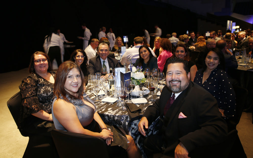 Gala attendees sitting at a table.